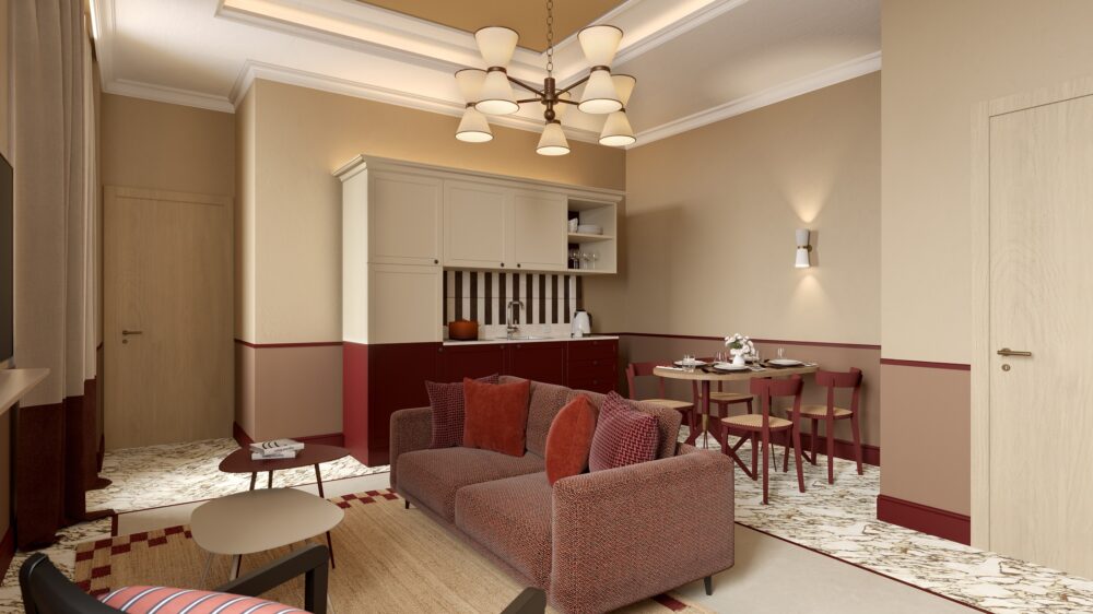 Living area con divano, angolo cucina e zona pranzo