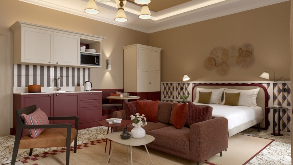 Monolocale elegante con cucina attrezzata, area living con divano e letto matrimoniale